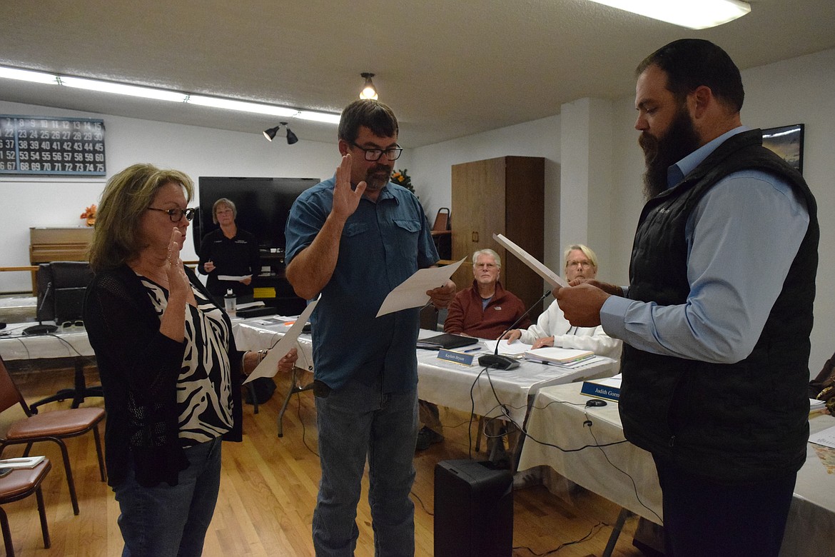 Soap Lake Mayor Peter Sharp administers the Oath of Office to the two newly appointed Soap Lake City Council members, Eli Olson and JoAnn Rushton at the Oct. 16 Soap Lake City Council meeting.