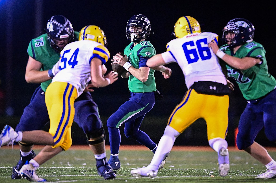 Glacier quarterback Jackson Presley (12) looks for an open receiver in the third quarter against Missoula Big Sky at Legends Stadium on Thursday, Oct. 17. (Casey Kreider/Daily Inter Lake)