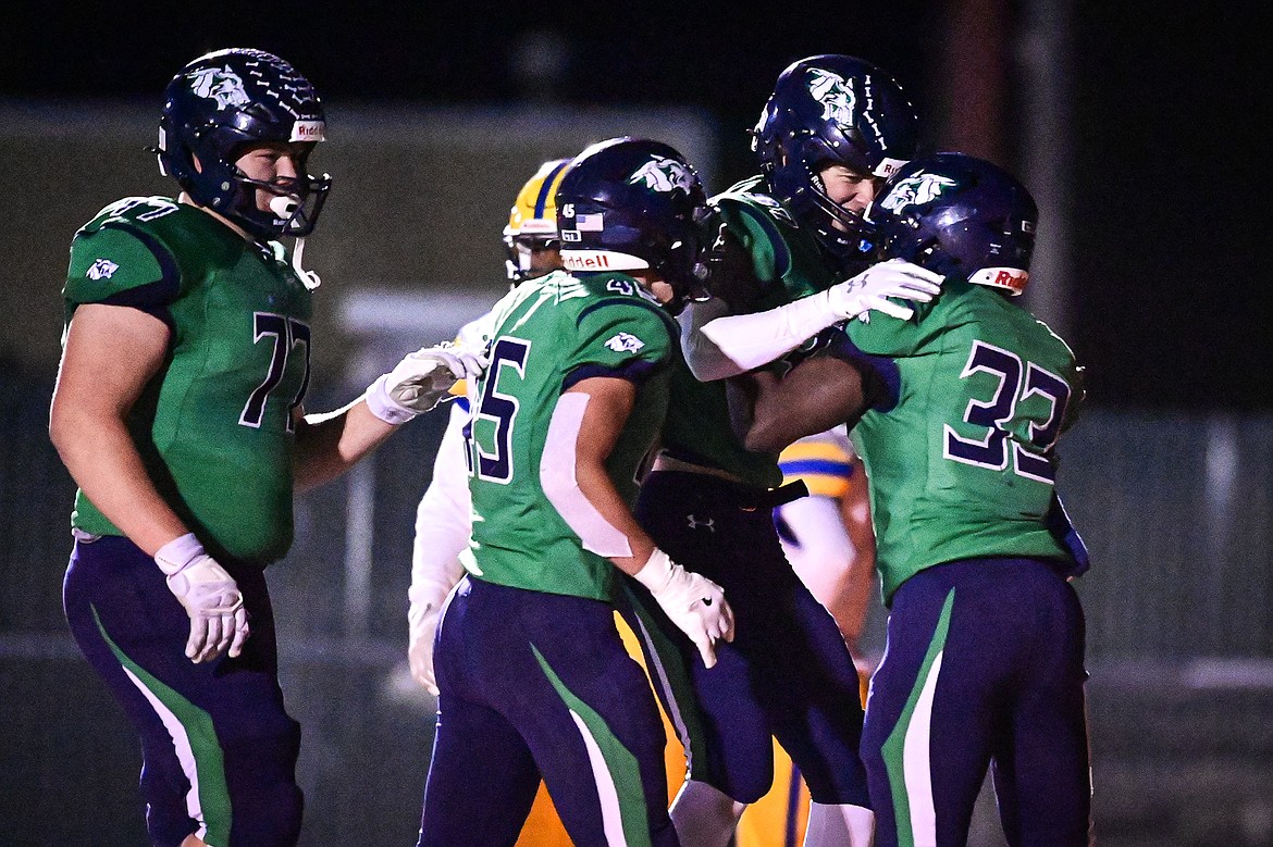 Glacier wide receiver Ethan Anderson (37) celebrates with running back Kobe Dorcheus (33), tight end Matthew Junk (45) and offensive lineman Maverick Diede (77) after a touchdown reception in the second half against Missoula Big Sky at Legends Stadium on Thursday, Oct. 17. (Casey Kreider/Daily Inter Lake)