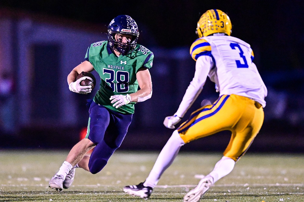 Glacier wide receiver Carson Baker (38) picks up yardage on a run in the first quarter against Missoula Big Sky at Legends Stadium on Thursday, Oct. 17. (Casey Kreider/Daily Inter Lake)