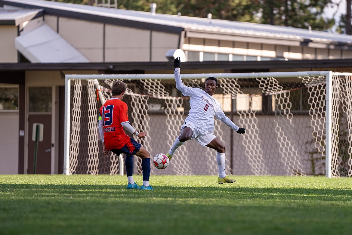 NIC ATHLETICS
North Idaho College freshman defender Reagan Gyedu attempts to clear the ball past Snow forward Jack Cook during the first half of Thursday's Scenic West Athletic Conference match at Eisenwinter Field.