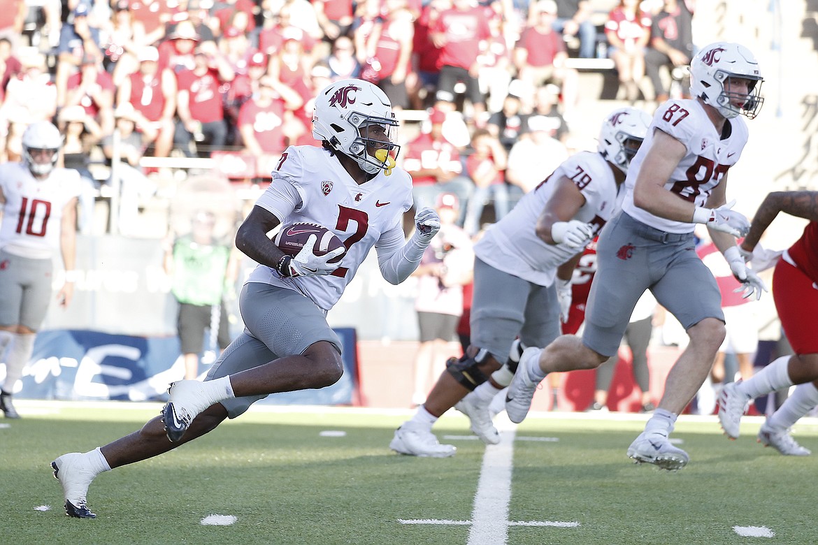 Washington State receiver Kyle Wiliams runs with the football during Saturday’s 25-17 win over Fresno State.