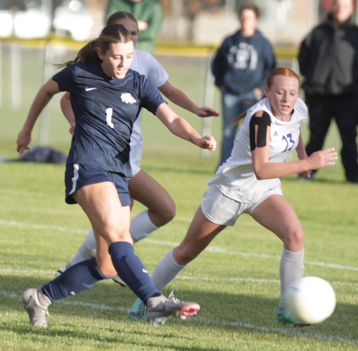 JASON ELLIOTT/Press
Lake City sophomore midfielder Addyson Kerley gets past Coeur d'Alene sophomore defender Makaela Randall during the second half of Thursday's 6A District 1 tournament match at the Irma Anderl Soccer Complex.