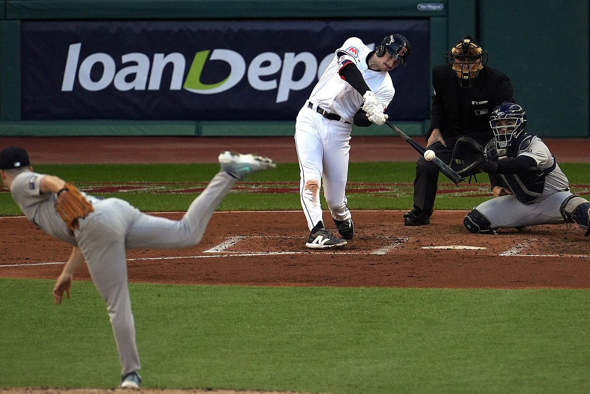 SUE OGROCKI/Associated Press
Former Lake City High star Kyle Manzardo of the Cleveland Guardians hits a two-run home off New York Yankees pitcher Clarke Schmidt during the third inning in Game 3 of the AL Championship Series on Thursday in Cleveland. Manzardo's homer gave Cleveland a 2-1 lead — then things got real crazy later.