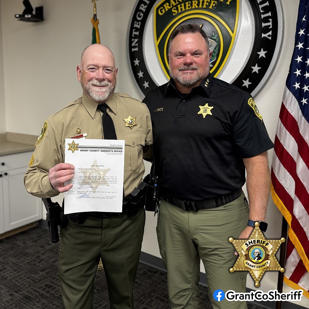 Grant County Sheriff Joey Kriete, right, administered the oath of office to newly-promoted Corrections Sergeant John Querin, left, Wednesday.