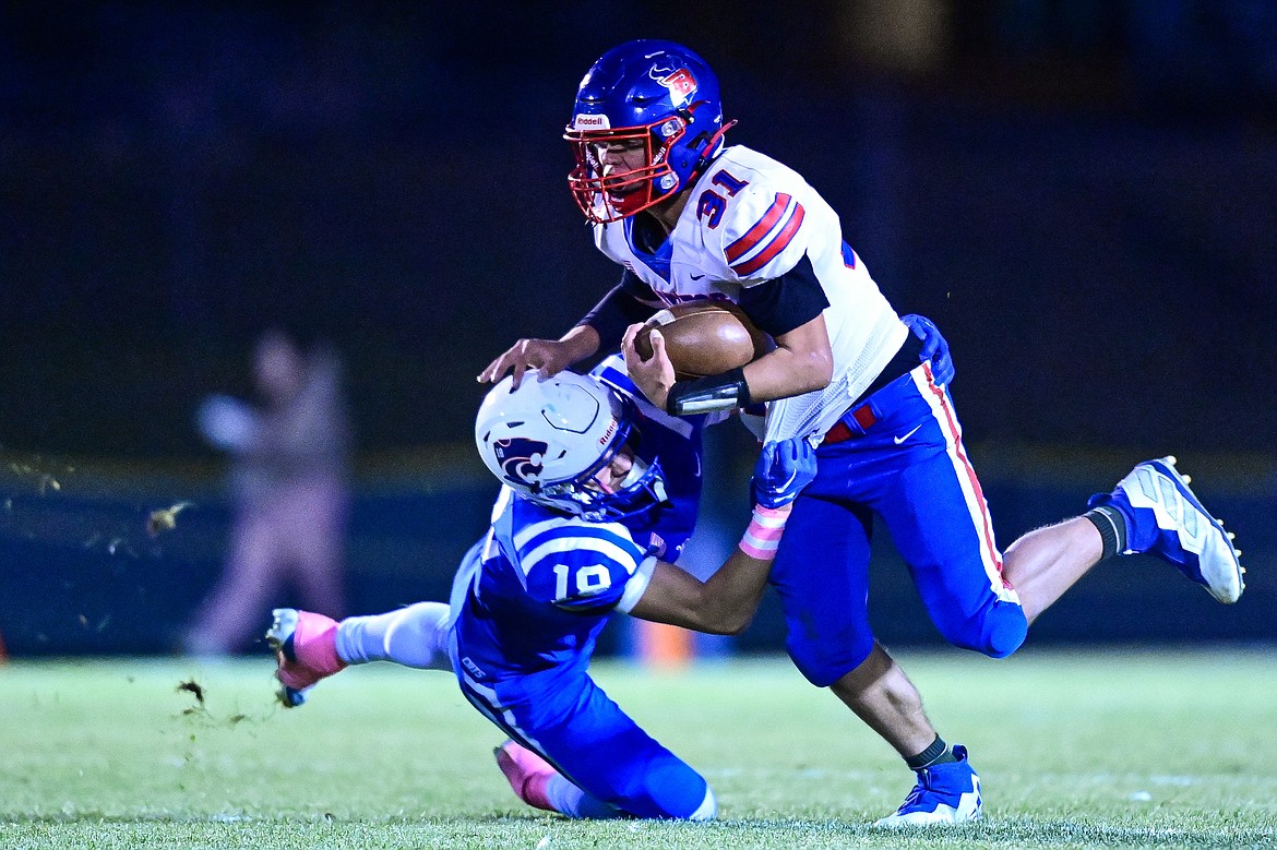 Bigfork running back Treker Hickey (31) looks for running room in the first quarter against Columbia Falls at Satterthwaite Field on Friday, Oct. 18. (Casey Kreider/Daily Inter Lake)