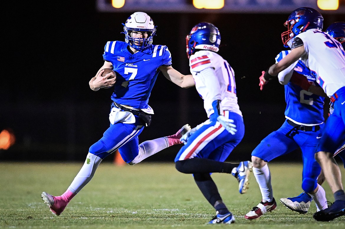 Columbia Falls quarterback Banyan Johnston (7) looks for running room in the first quarter against Bigfork at Satterthwaite Field on Friday, Oct. 18. (Casey Kreider/Daily Inter Lake)