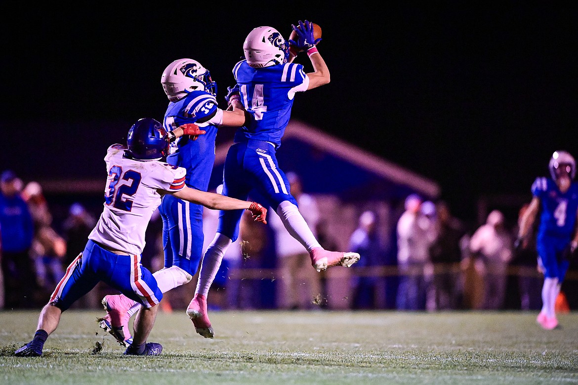 Columbia Falls safety Jory Hill (14) intercepts a pass in the third quarter against Bigfork at Satterthwaite Field on Friday, Oct. 18. (Casey Kreider/Daily Inter Lake)