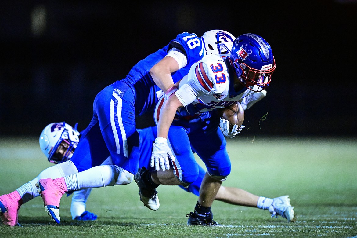 Bigfork wide receiver Tayden West (33) picks up yardage after a reception in the fourth quarter against Columbia Falls at Satterthwaite Field on Friday, Oct. 18. (Casey Kreider/Daily Inter Lake)