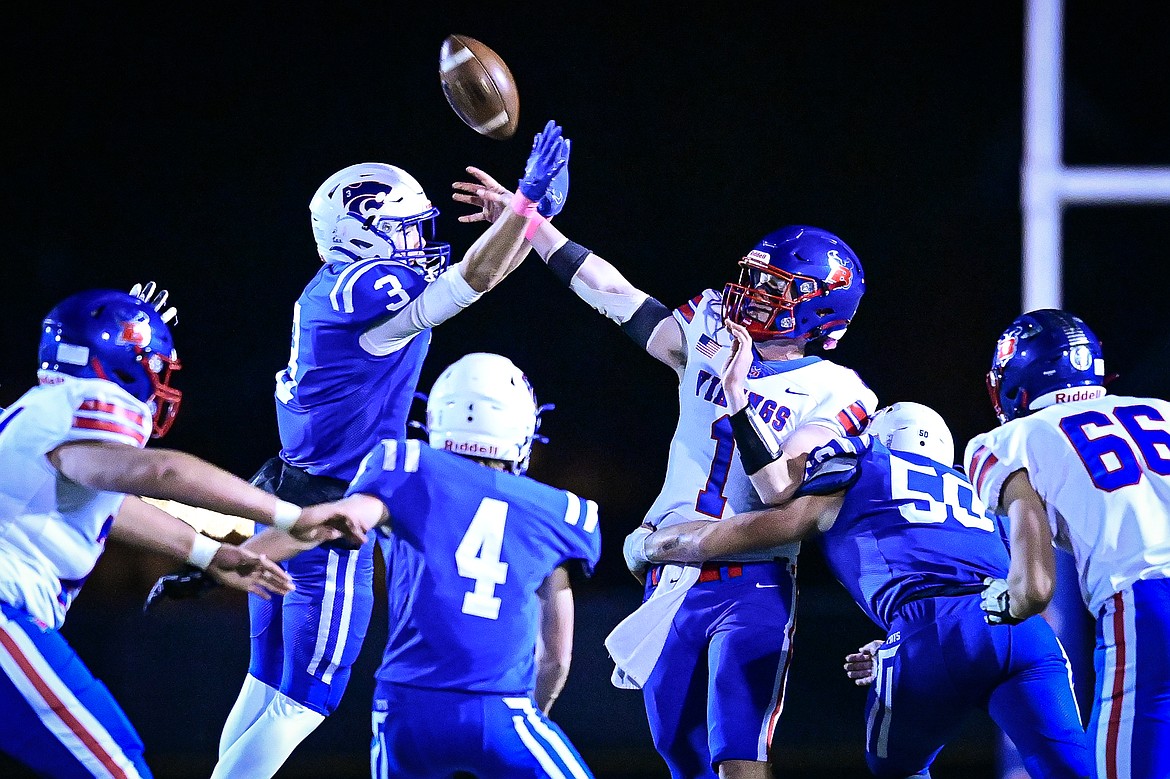 Columbia Falls defenders disrupt a pass attempt by Bigfork quarterback Cole Schmit (1) in the third quarter at Satterthwaite Field on Friday, Oct. 18. (Casey Kreider/Daily Inter Lake)