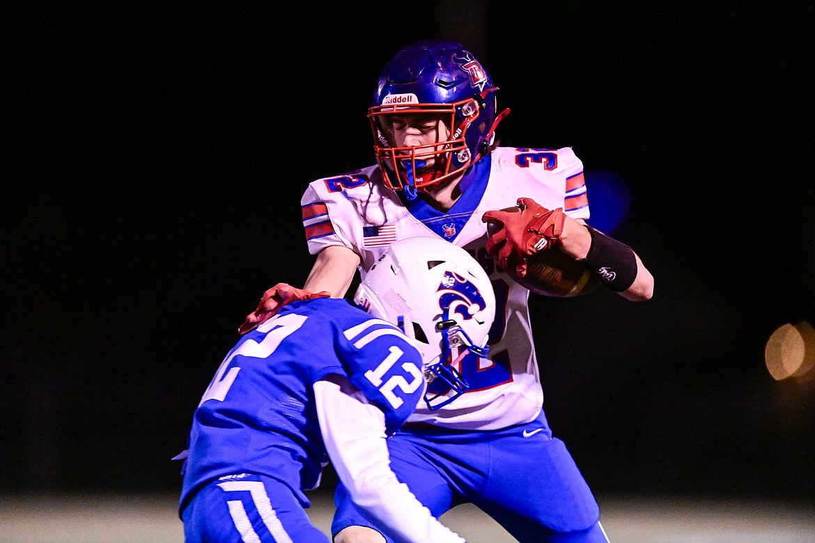 Bigfork tight end Austin Savik (32) picks up yardage after a reception in the third quarter against Columbia Falls at Satterthwaite Field on Friday, Oct. 18. (Casey Kreider/Daily Inter Lake)