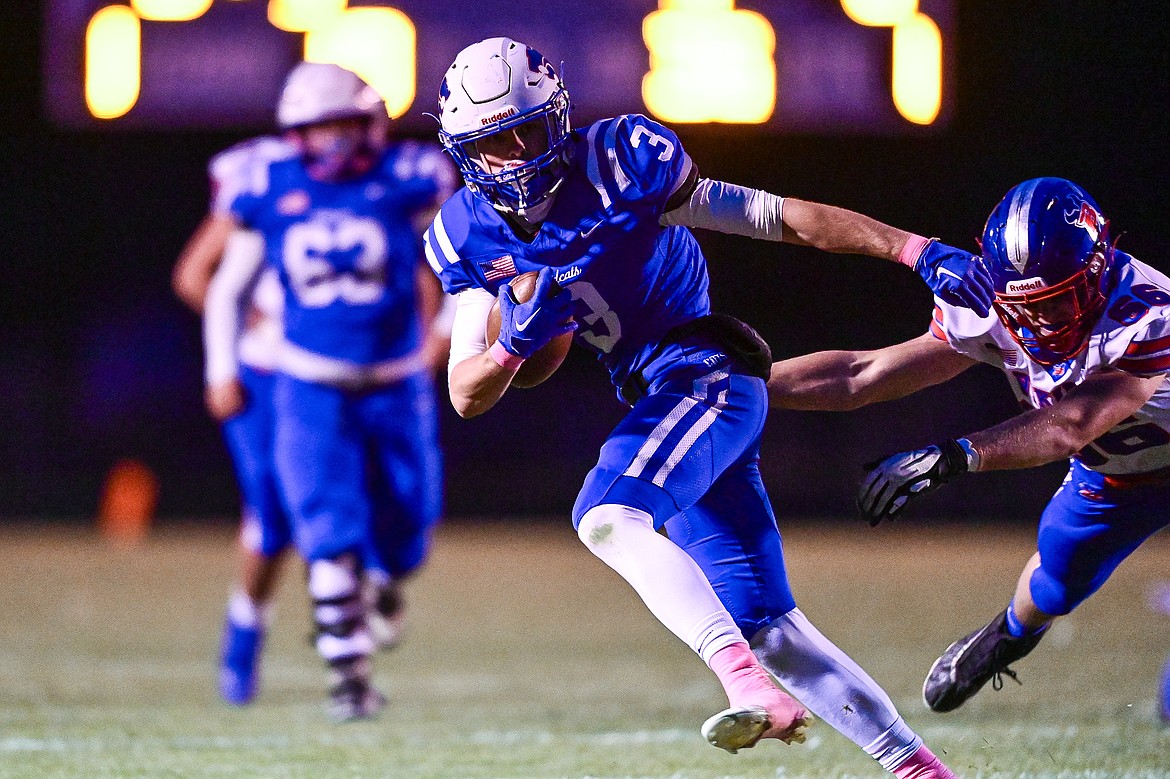 Columbia Falls wide receiver Cooper Ross (3) picks up yardage after a reception in the first quarter against Bigfork at Satterthwaite Field on Friday, Oct. 18. (Casey Kreider/Daily Inter Lake)