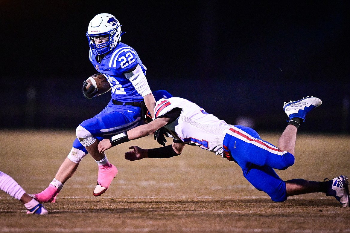 Columbia Falls running back Reggie Sapa (22) looks for running room in the first quarter against Bigfork at Satterthwaite Field on Friday, Oct. 18. (Casey Kreider/Daily Inter Lake)