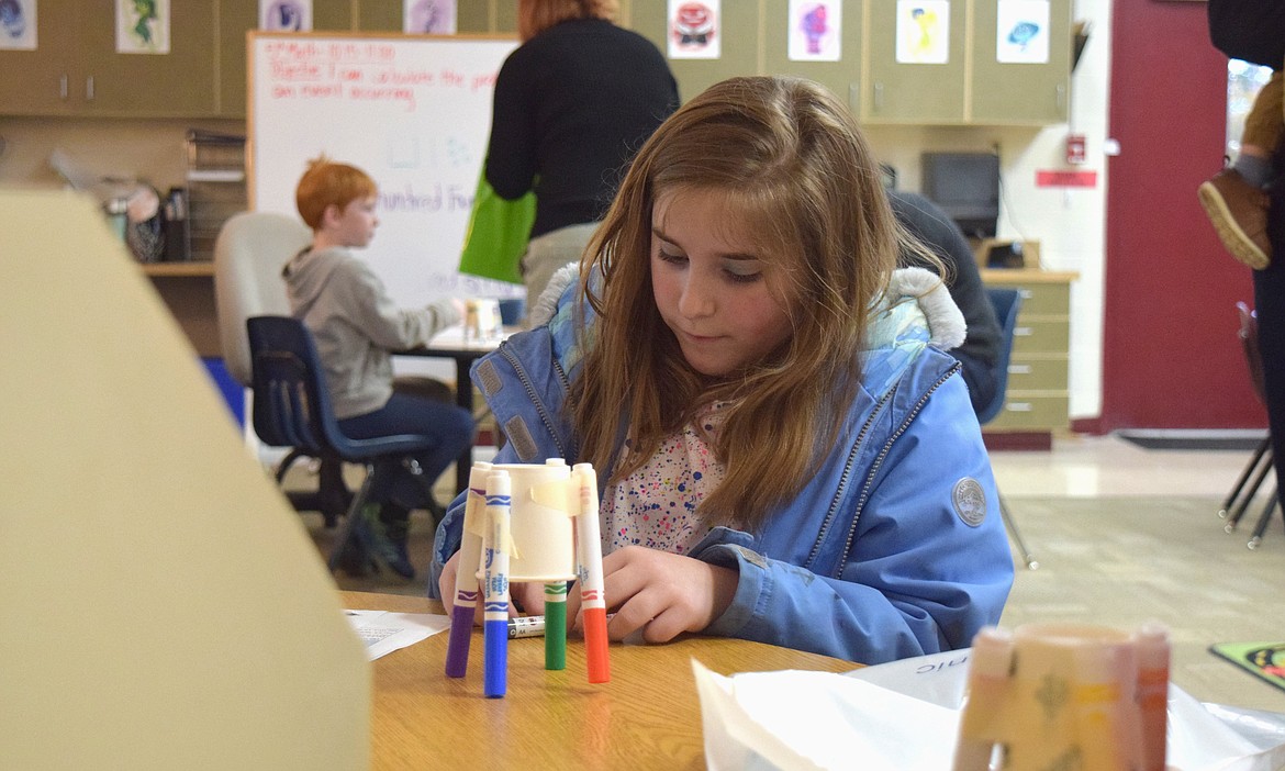 Alexa, 9, builds a "Scribblebot" as she learns the basics of electricity at Thursday night's STEM Night at Ramsey Magnet School of Science.