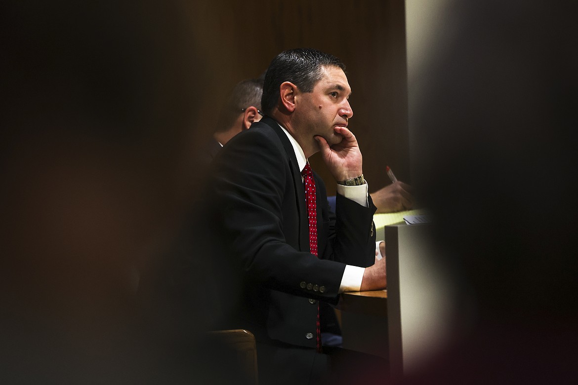 Montana Attorney General Austin Knudsen listens to testimony in his own professional misconduct trial before the Commission on Practice in the Montana Supreme Court Chambers on Wednesday, Oct. 9, 2024, in Helena, Mont. (Thom Bridge/Independent Record via AP)