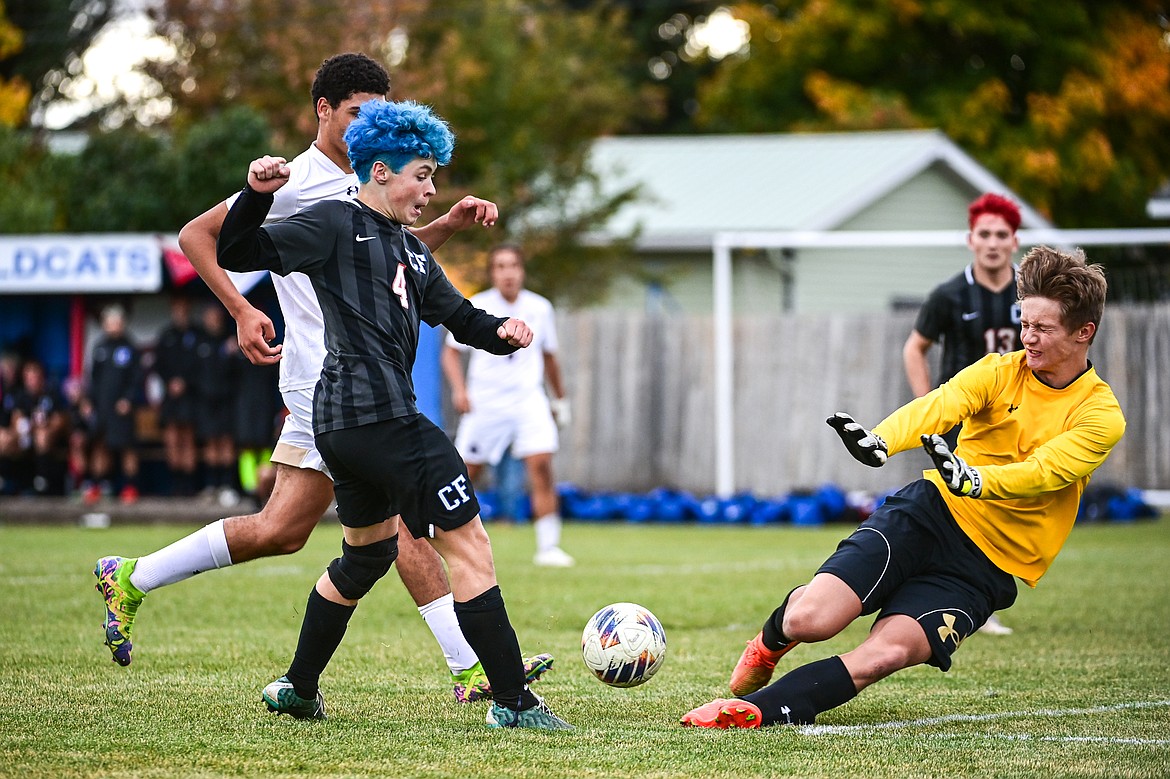 Columbia Falls' Isak Soyland (4) passes to Max Everett (13) for a goal in the second half against Polson during the Class A soccer quarterfinals at Flip Darling Memorial Field on Saturday, Oct. 19. (Casey Kreider/Daily Inter Lake)