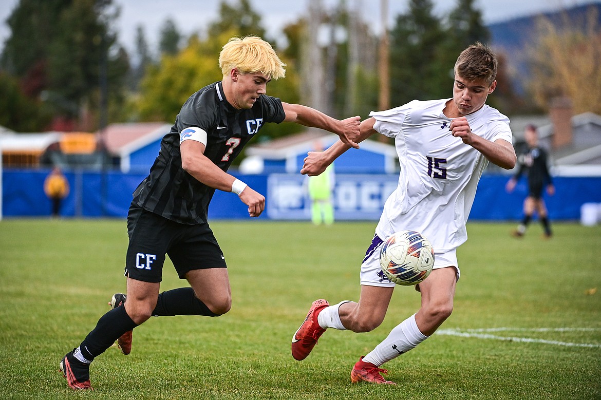 Columbia Falls' River Wolford (7) tries to get past Polson's Afton Hatch (15) in the first half of the Class A soccer quarterfinals at Flip Darling Memorial Field on Saturday, Oct. 19. (Casey Kreider/Daily Inter Lake)