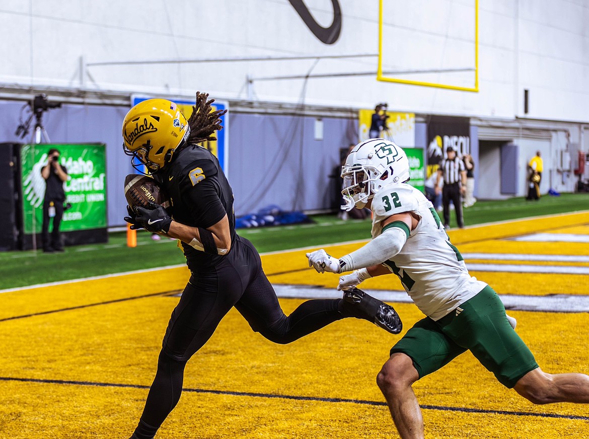 Photo by IDAHO ATHLETICS
Jordan Dwyer of Idaho catches a touchdown pass in the second half as Mason Rivera (32) of Cal Poly defends Saturday at the Kibbie Dome in Moscow.