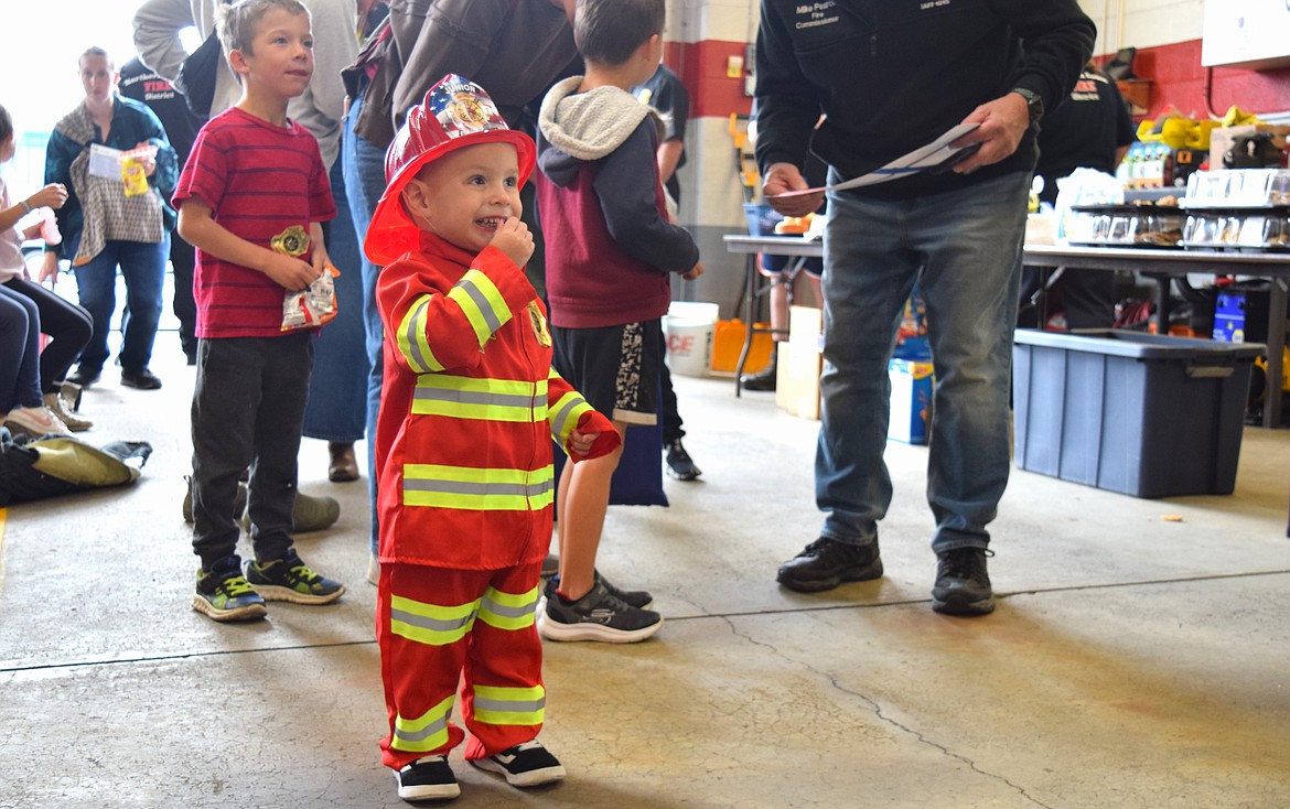 Kaleb, 2, is all smiles at the Northern Lakes Fire Department's open house in Hayden on Saturday.