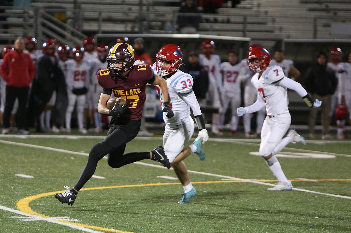 Moses Lake junior Grant Smith (13) outruns a pair of Eastmont defenders on a 60-yard catch-and-run in the fourth quarter of Friday’s win over the Wildcats. Smith finished the game with 117 yards and two touchdowns on seven catches.