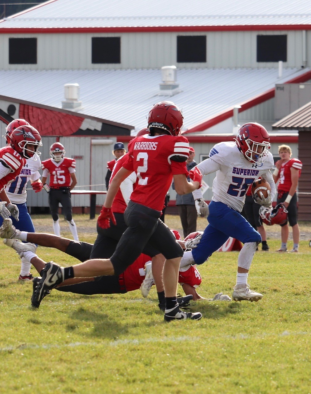 Sophomore running back Turner Milender, who played sparingly in the game due to an early injury, attempts to turn the corner and head up field during Superior's game Friday night versus Arlee, in Arlee.  (Photo by Kami Milender)