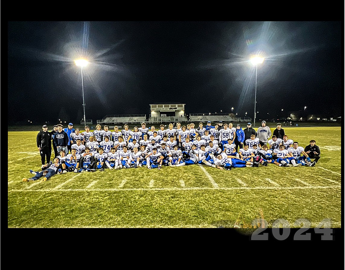 Photo by JULIE SPEELMAN
The Coeur d'Alene High freshman football team capped a 9-0 season last Thursday with a 28-8 victory on the road over the Post Falls Trojans. In the front row from left are Eli Cooper, James Scott, Sam Priebe, Gage Gatten, Chase Gordon, Logan Nitti, Brody Reeves, Prentice Palmgren, Tegan Covey, Josh Sampson, Jake Paulsen, Asynn Gentry, Jaxon Schillinger, Ty Ball, Brady Thompson, Reed Robbins, Carson Weber, Kaya Bosse, Jaxon Bowman, Milo Cord, Ian Sadler, Coleton Harper and Jacob Shriner; second row from left, Grant McPhee, Bronson Youngman, Ayden Van Rossum, Logan Melville, Ryan Drapeau, Teigan Smith, Daniel Burt, Drake Speelman, Cruz Paulin, Parker Stearns, Raif Goode, Hudson Petticolas, Dylan Coulson, Dallen Ganske, Jax Hufstetler and James Roscoe; and back row from left, coach Cade Prado, coach Blake Whiteman, Chris Craig, head coach Corey Comstock, Ron Kinkaid, Aaron Garvin, Esa Zaborski, Brody Nokes, Zach Trutter, Tytan Aga, Max Lilley, Parker Martin, Anthony Eastwood, Kolt Archuleta, Wyatt Kuklinski, Rogan Velin, Gage Pagano, William Mahoney, Tucker Douglas, Kolton Anderson, coach Jason Paulin, Tyson Jewell, coach Matt Howard, Isaac Loewe, Chase Green, coach Chad Booth, coach Nate Tuttle and coach Mike Borowski.