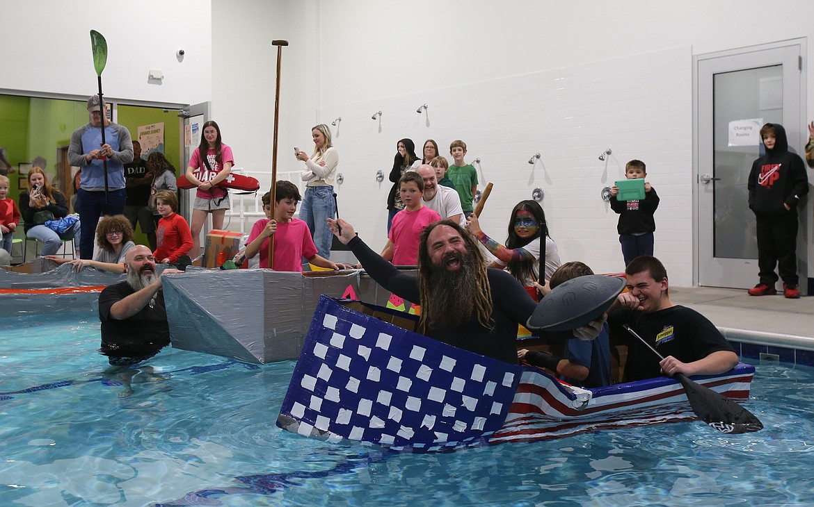 "Handpan Man" Ethereal in E jumps in with Connor Groat and Mason Traxler for a photo opportunity Monday at SafeSplash SwimLabs during Woodland Middle School's cardboard boat races.