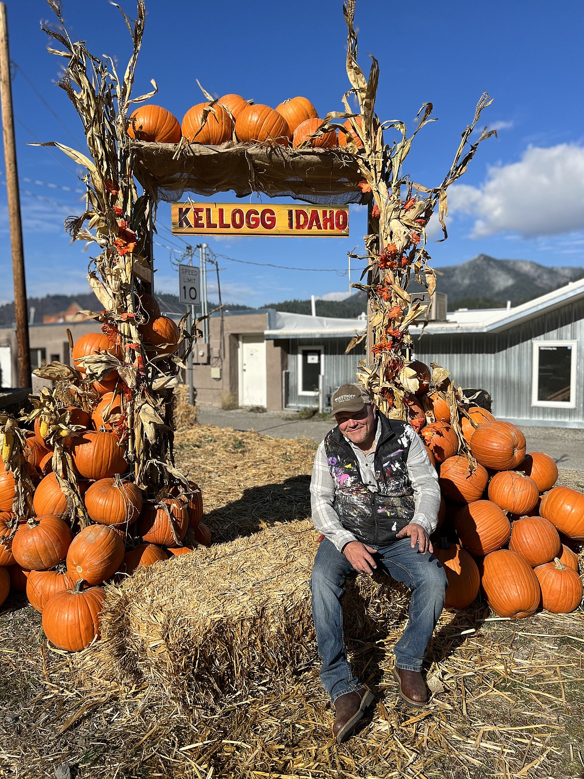 Painter Denny Wuesthoff sits by the pumpkin arrangement during Kelloween 2023. This year's Halloween fun is scheduled for Saturday, Oct. 26 with events ranging from across the city of Kellogg.