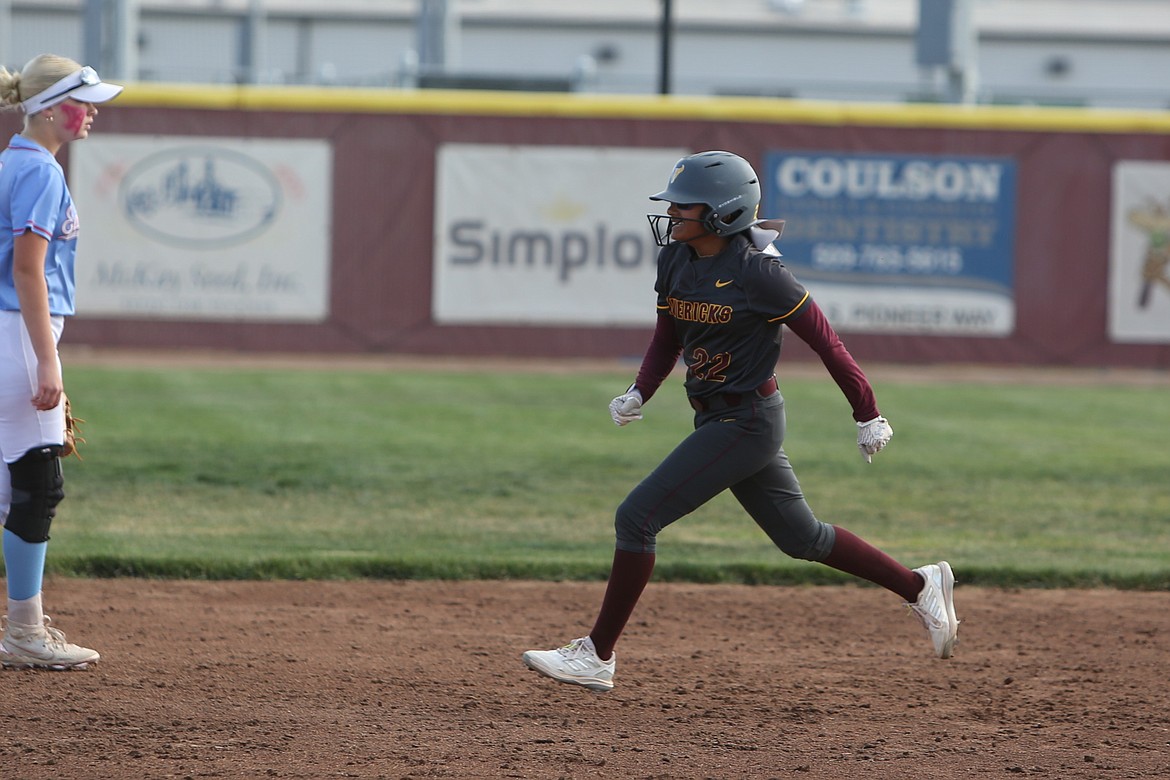 Moses Lake freshman Mya Martinez celebrates while rounding the bases after hitting her second home run of the game against Eastmont on Saturday.