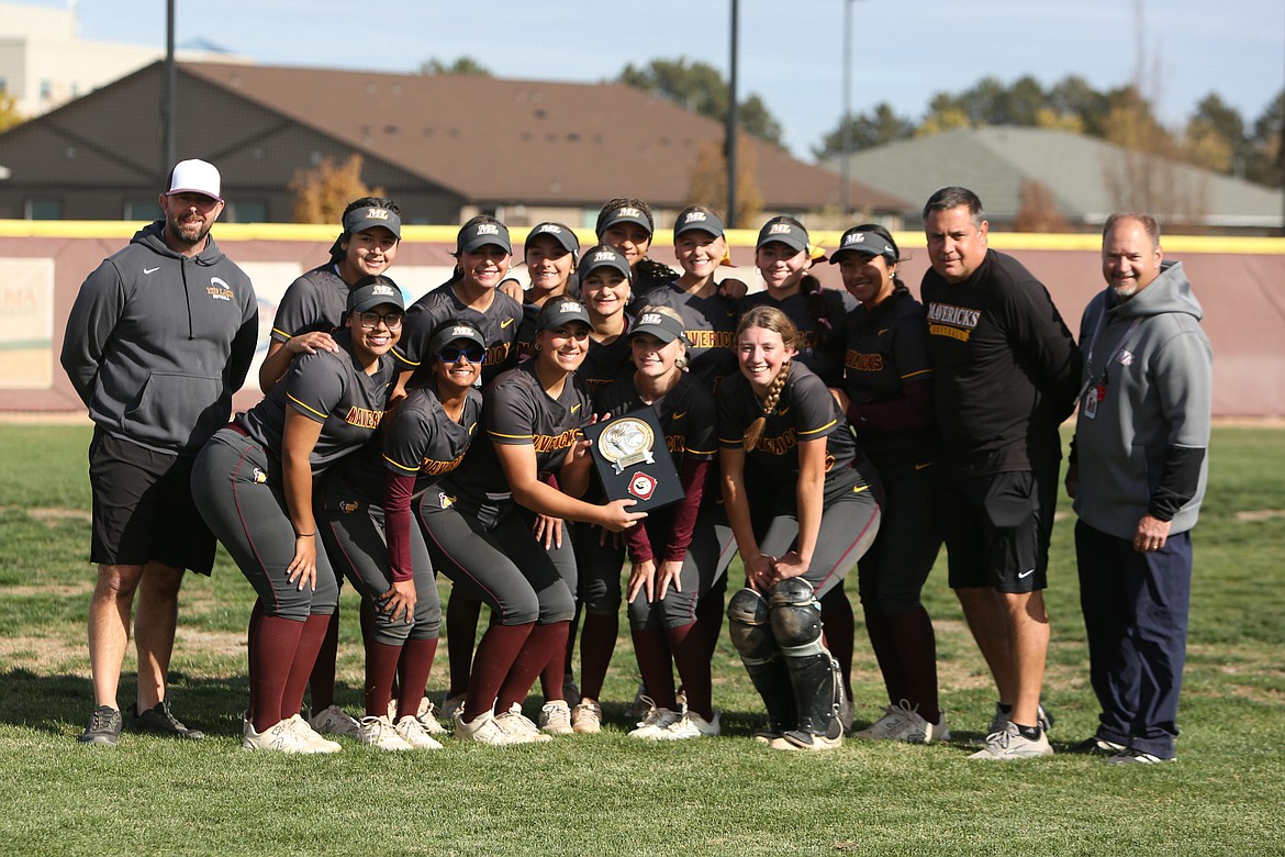 The Moses Lake slowpitch softball team smiles in celebration after defeating Eastmont 21-7 in the Columbia Basin Big 9 district championship game on Saturday.