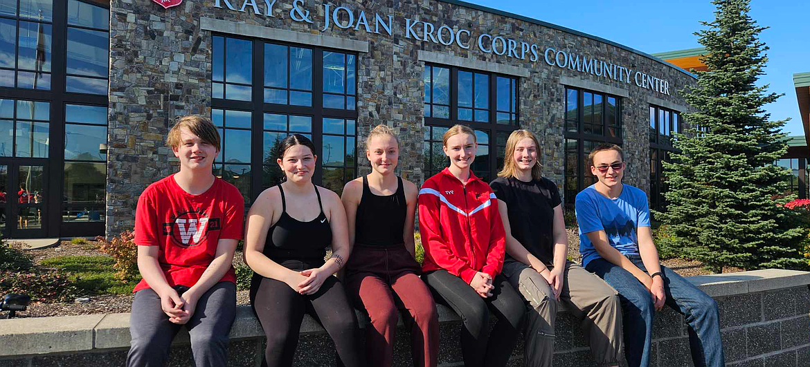 Swimmers Gage Wood, Ember Meyer, Annika Kessler, Aubrey Parks, and Aaron Berry grab a team photo during a recent swim meet at the Kroc Center in Coeur d'Alene.