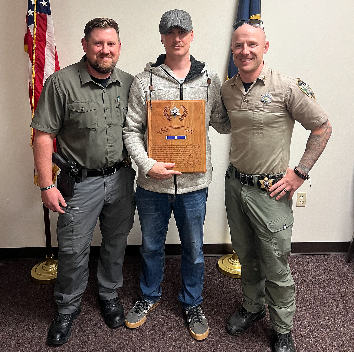 Undersheriff Stutzke also awarded Detective Will Keller (center) with the Law Enforcement Purple Heart. Keller was attacked during a welfare check that resulted in permanent damage to Keller's knee.