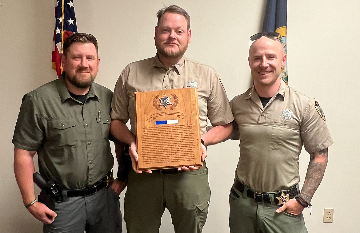 Shoshone County Undersheriff Lance Stutzke (left) stands with Corporal Darius Dustin (center), and Patrol Captain Seth Green. Dustin was awarded the Medal of Valor for his part in a lethal standoff in 2022.