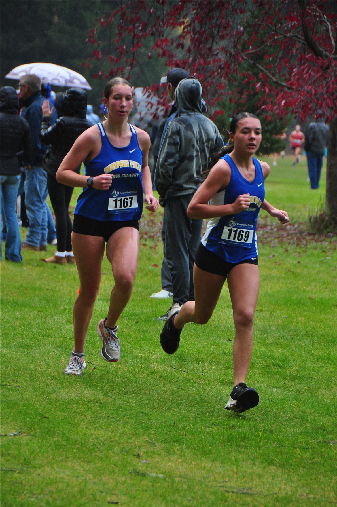 Thompson Falls cross country runners Aubrey Baxter (left) and Audrey Fairbank (right) on their way to the team championship at this year's Western B/C Divisional championship this past Saturday in Missoula.  (Photo by Sarah Naegeli)