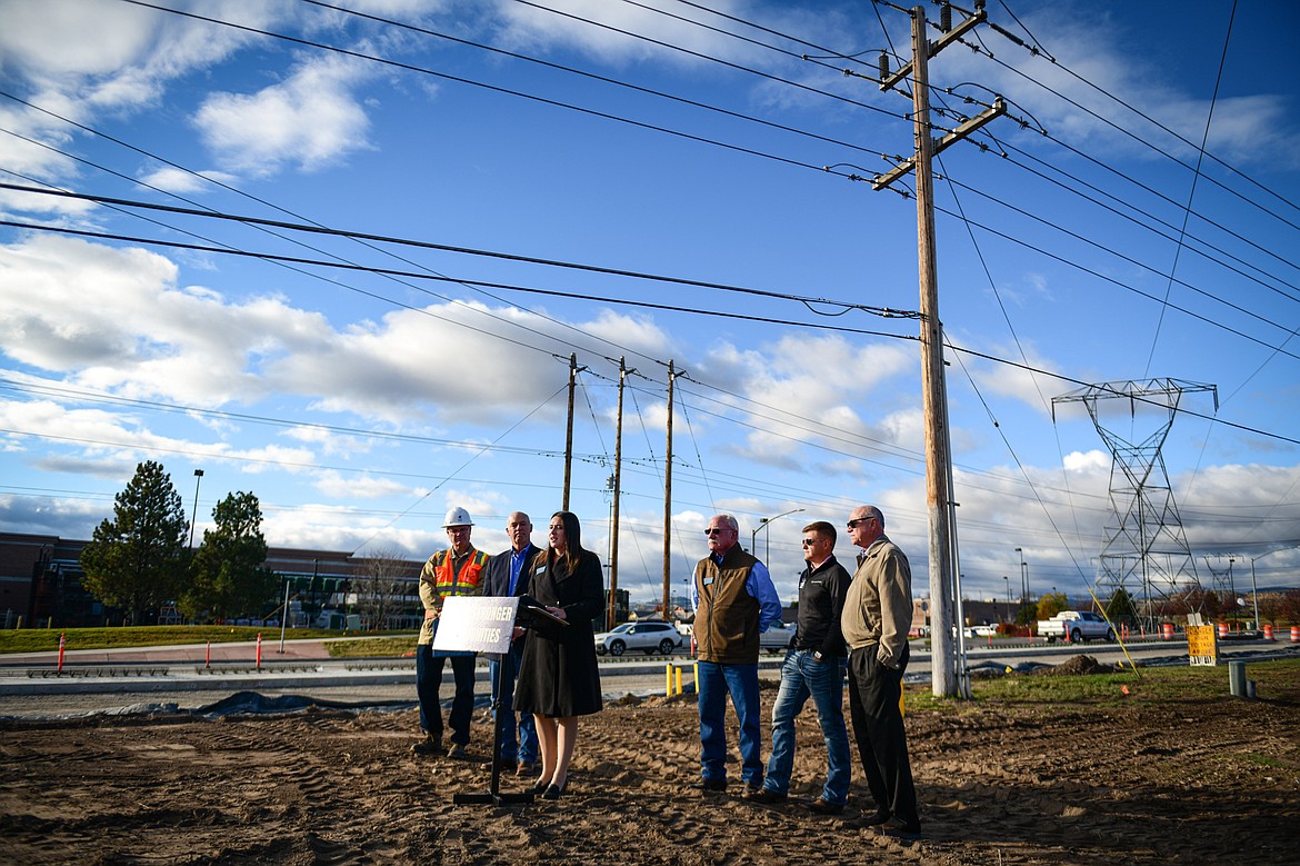 Rep. Courtenay Sprunger speaks during a press conference highlighting infrastructure investments with, from left, Montana Department of Transportation Deputy Director Larry Flynn, Gov. Greg Gianforte, Sen. John Fuller, Rep. Braxton Mitchell and Sen. Mark Noland at the Reserve Drive road construction project on Tuesday, Oct. 22. (Casey Kreider/Daily Inter Lake)