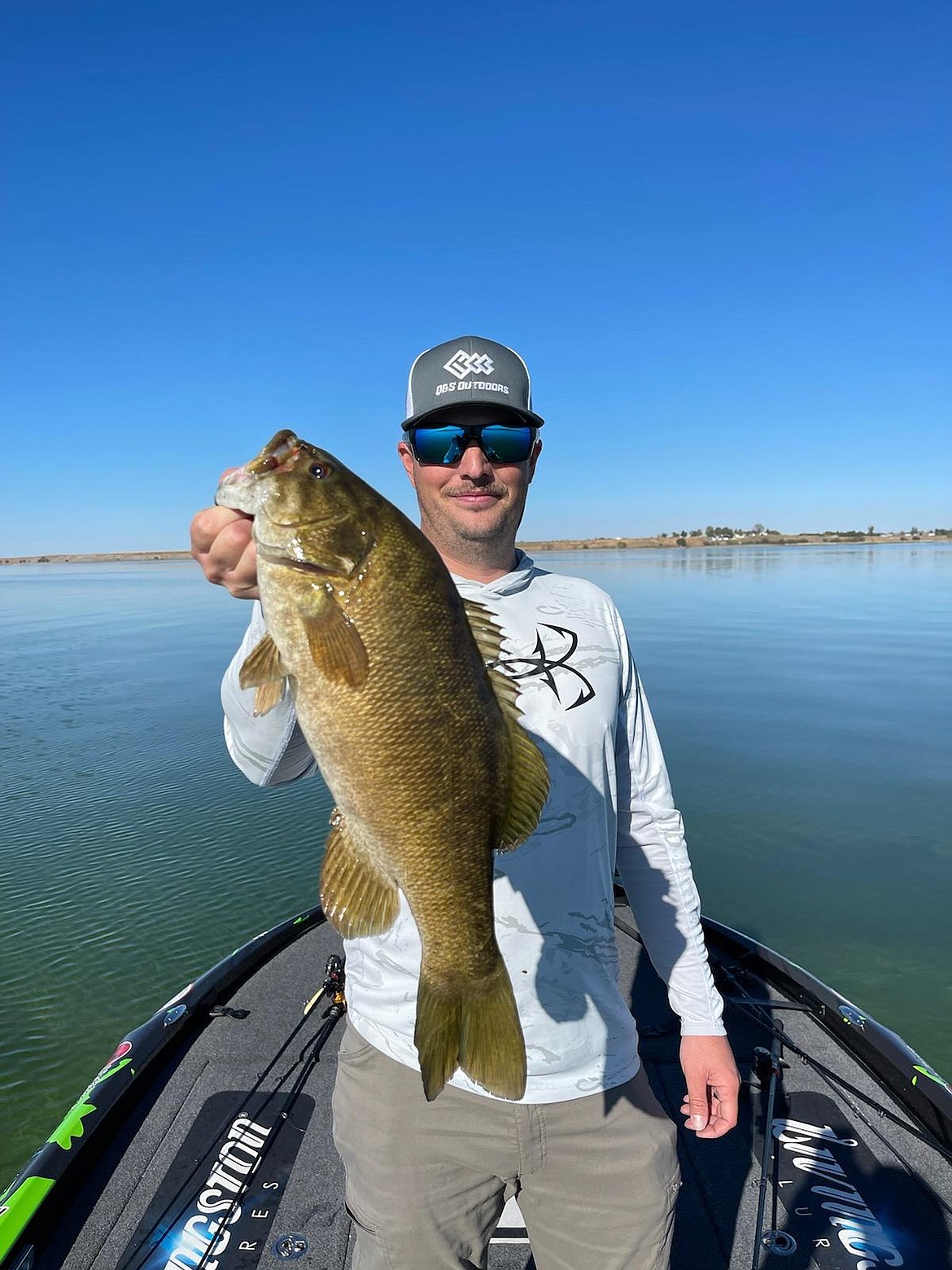 Wyatt Smith holds a smallmouth bass.