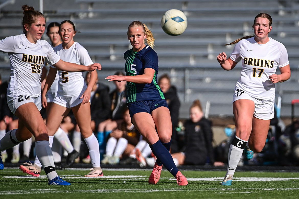 Glacier's Neve Travis (5) directs a ball into the box in the first half against Helena Capital in the first round of the Class AA playoffs at Legends Stadium on Tuesday, Oct. 22. (Casey Kreider/Daily Inter Lake)