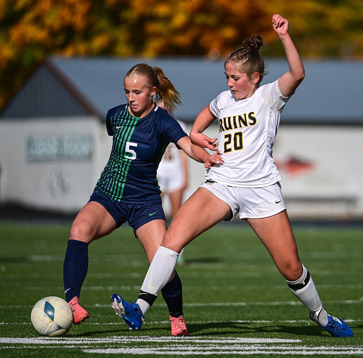 Glacier's Neve Travis (5) pushes the ball upfield in the first half against Helena Capital in the first round of the Class AA playoffs at Legends Stadium on Tuesday, Oct. 22. (Casey Kreider/Daily Inter Lake)