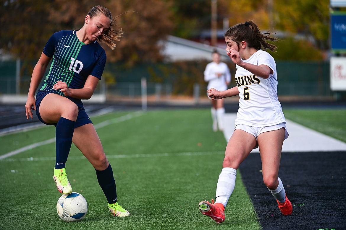 Glacier's Gracie Winkler (10) makes a move on defender in the first half against Helena Capital in the first round of the Class AA playoffs at Legends Stadium on Tuesday, Oct. 22. (Casey Kreider/Daily Inter Lake)