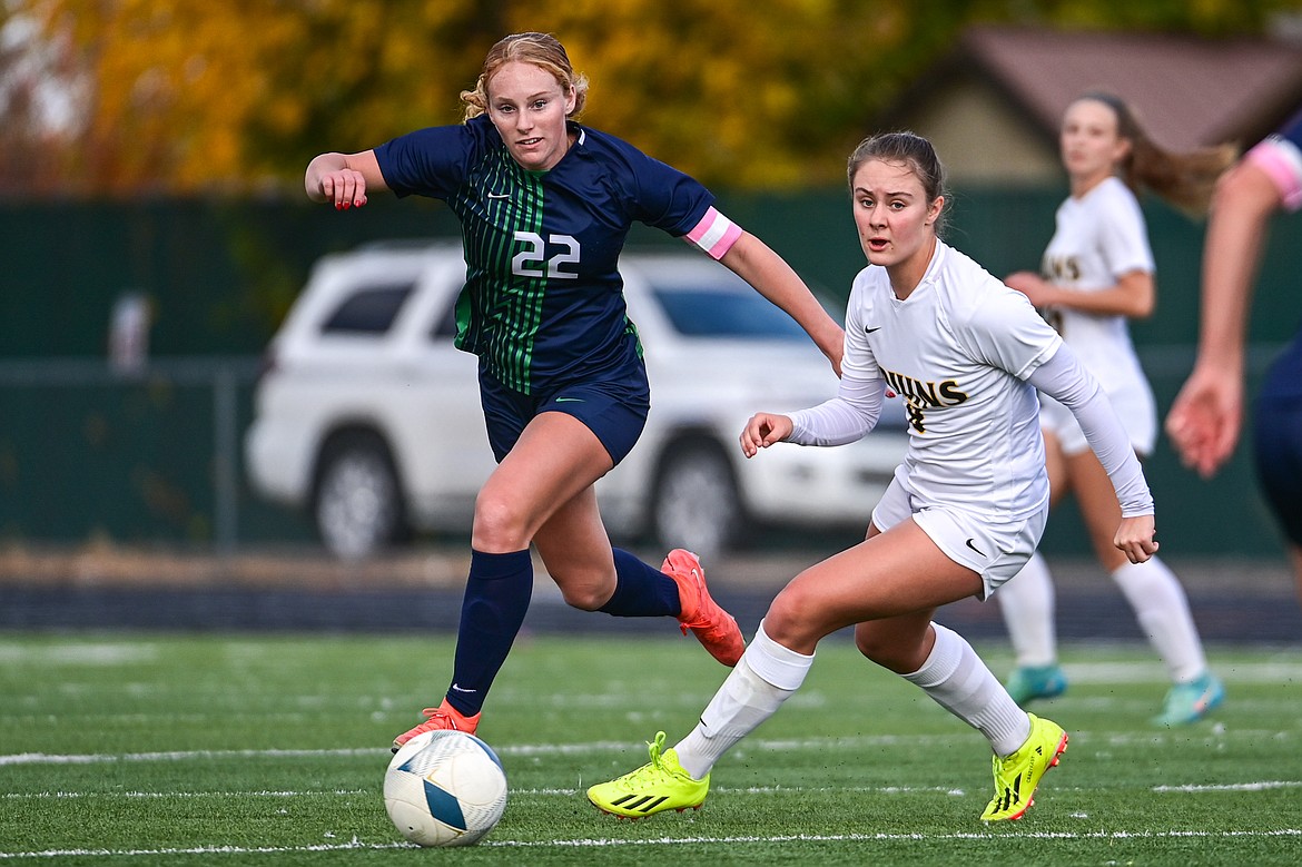 Glacier's Reese Ramey (22) pushes the ball upfield in the first half against Helena Capital in the first round of the Class AA playoffs at Legends Stadium on Tuesday, Oct. 22. (Casey Kreider/Daily Inter Lake)