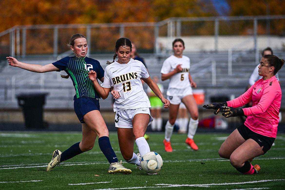 Glacier's Lucy Holloway (12) has a scoring attempt stopped by Helena Capital keeper Ashlynn Cornwell (10) in the first half against of the first round of the Class AA playoffs at Legends Stadium on Tuesday, Oct. 22. (Casey Kreider/Daily Inter Lake)