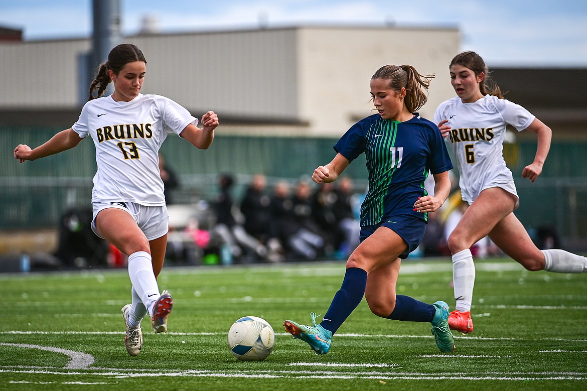 Glacier's Bailee Dahlman (11) has a passes to a teammate in the second half against Helena Capital in the first round of the Class AA playoffs at Legends Stadium on Tuesday, Oct. 22. (Casey Kreider/Daily Inter Lake)