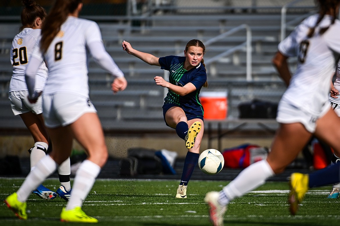 Glacier's Lucy Holloway (12) directs a shot in the first half against Helena Capital in the first round of the Class AA playoffs at Legends Stadium on Tuesday, Oct. 22. (Casey Kreider/Daily Inter Lake)