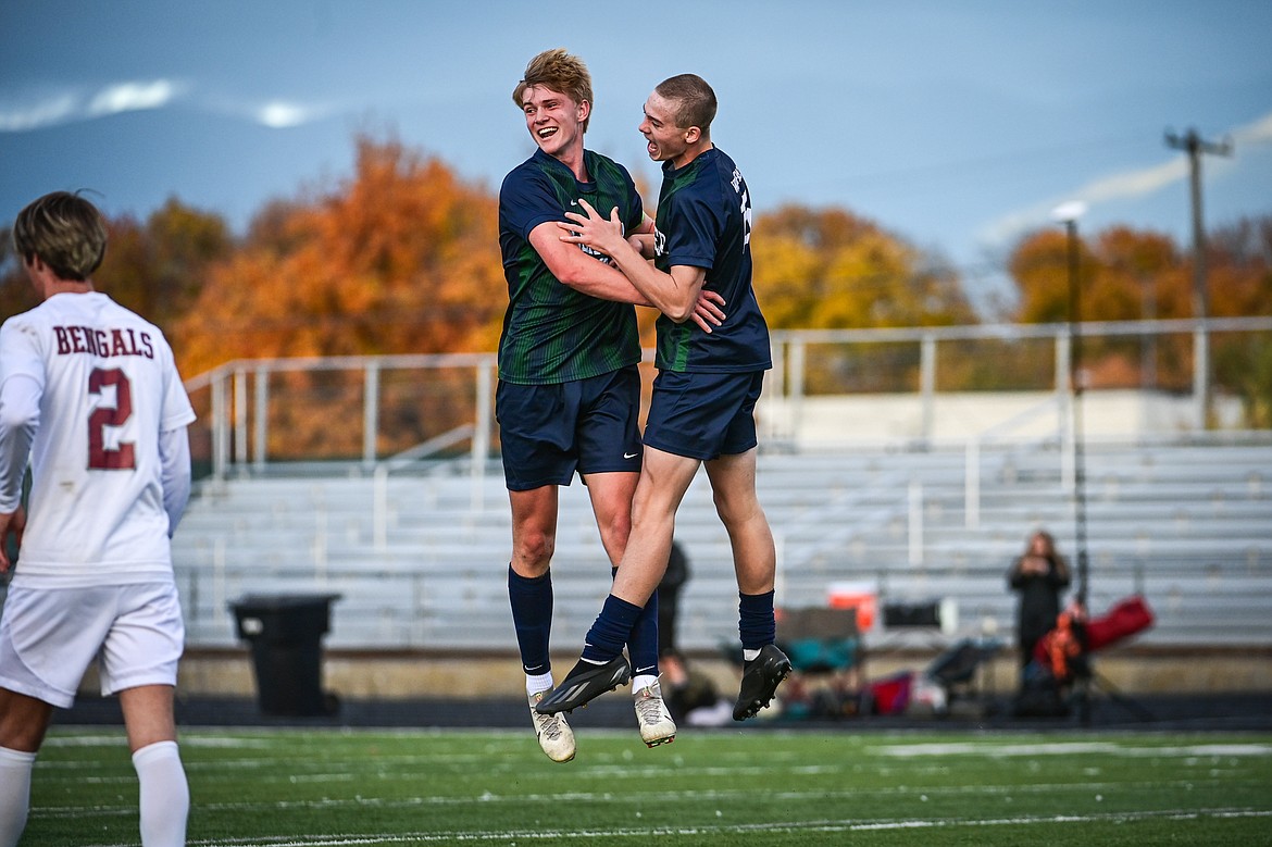 Glacier's Liam Ells (6) and Brecken Evenson (15) celebrate after Ells' second goal of the first half against Helena in the first round of the Class AA playoffs at Legends Stadium on Tuesday, Oct. 22. (Casey Kreider/Daily Inter Lake)