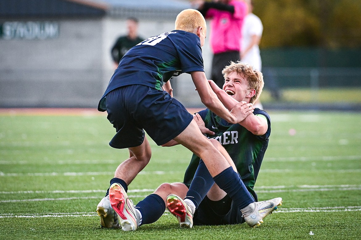 Glacier's Liam Ells (6) celebrates with Alex Hoerner (20) after scoring his third goal of the game in the first round of the Class AA playoffs at Legends Stadium on Tuesday, Oct. 22. (Casey Kreider/Daily Inter Lake)