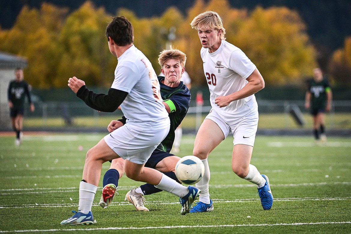 Glacier's Liam Ells (6) splits two Helena defenders for his third goal of the game in the first round of the Class AA playoffs at Legends Stadium on Tuesday, Oct. 22. (Casey Kreider/Daily Inter Lake)