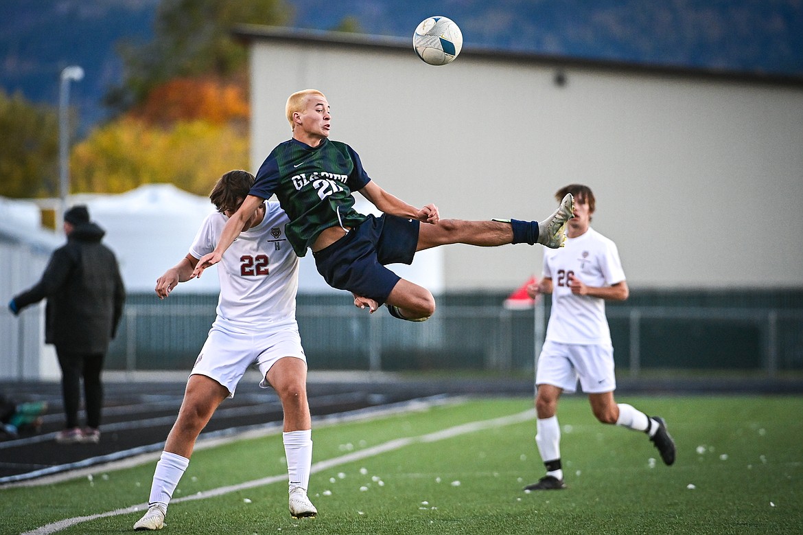 Glacier's Alex Hoerner (20) heads a ball in the second half against Helena in the first round of the Class AA playoffs at Legends Stadium on Tuesday, Oct. 22. (Casey Kreider/Daily Inter Lake)