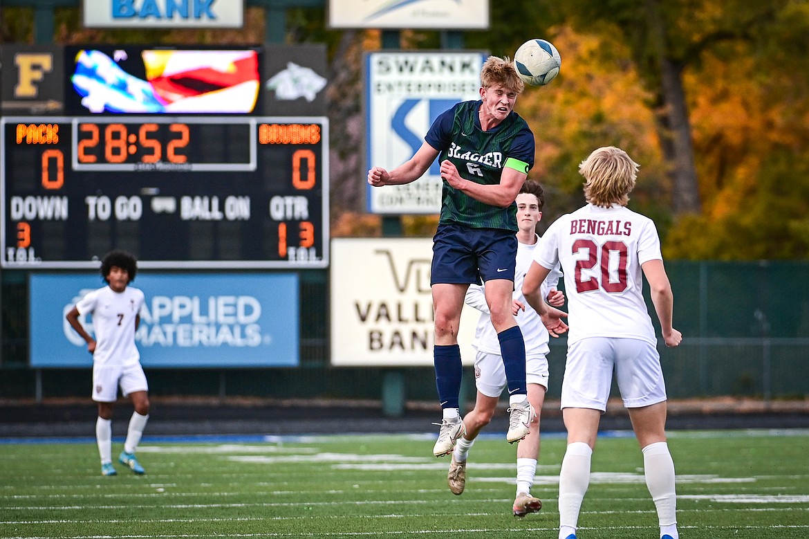 Glacier's Liam Ells (6) heads a ball off a goal kick in the first half against Helena in the first round of the Class AA playoffs at Legends Stadium on Tuesday, Oct. 22. (Casey Kreider/Daily Inter Lake)