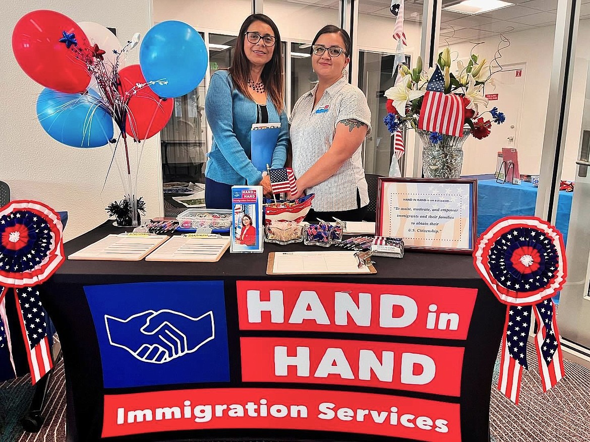 Norma Gallegos, left, program director for Hand in Hand Immigration Services, and Claudia Bovee, Latino services manager for NCW Libraries, attend a citizenship ceremony at Wenatchee Public Library in June.