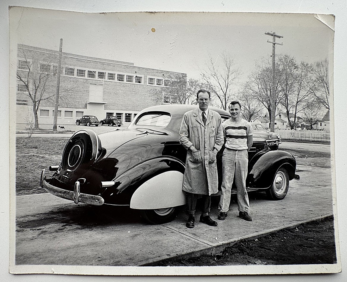 Former automotive teacher Wallace McCulloch poses with a student in front of a 1939 customized Buick at Flathead High School (formerly Flathead County High School) in this 1952 photo. The auto program marks 75 years at FHS. (Hilary Matheson/Daily Inter Lake)